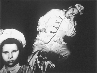 Weegee, At the movies - sleeping vendor (1940), silver gelatin photograph