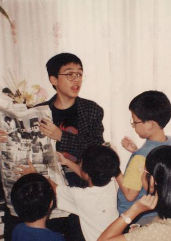 Family photograph of Teik-Kim Pok performing magic in Singapore circa 1995 