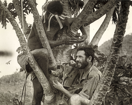 Damien Parer, 1943, with New Guinean assistant Cyril and Newman Sinclair camera