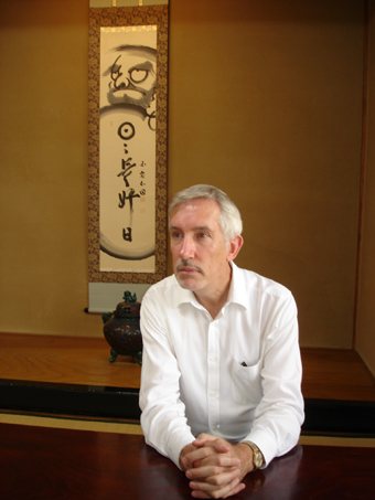 Stephen Whittington with a daruma illustration, Japan