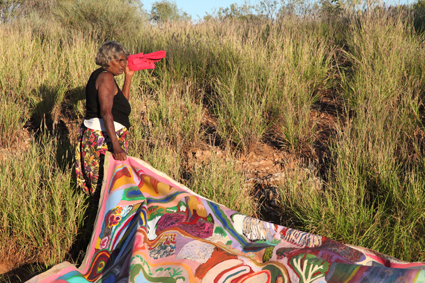  Amy French with her painting Karlamilyi, acrylic on canvas, 2010, at Karlamilyi 2011, We Don't Need a Map